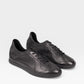 Yeossal black leather unlined GAT sneakers with lace-up closure and perforated details.